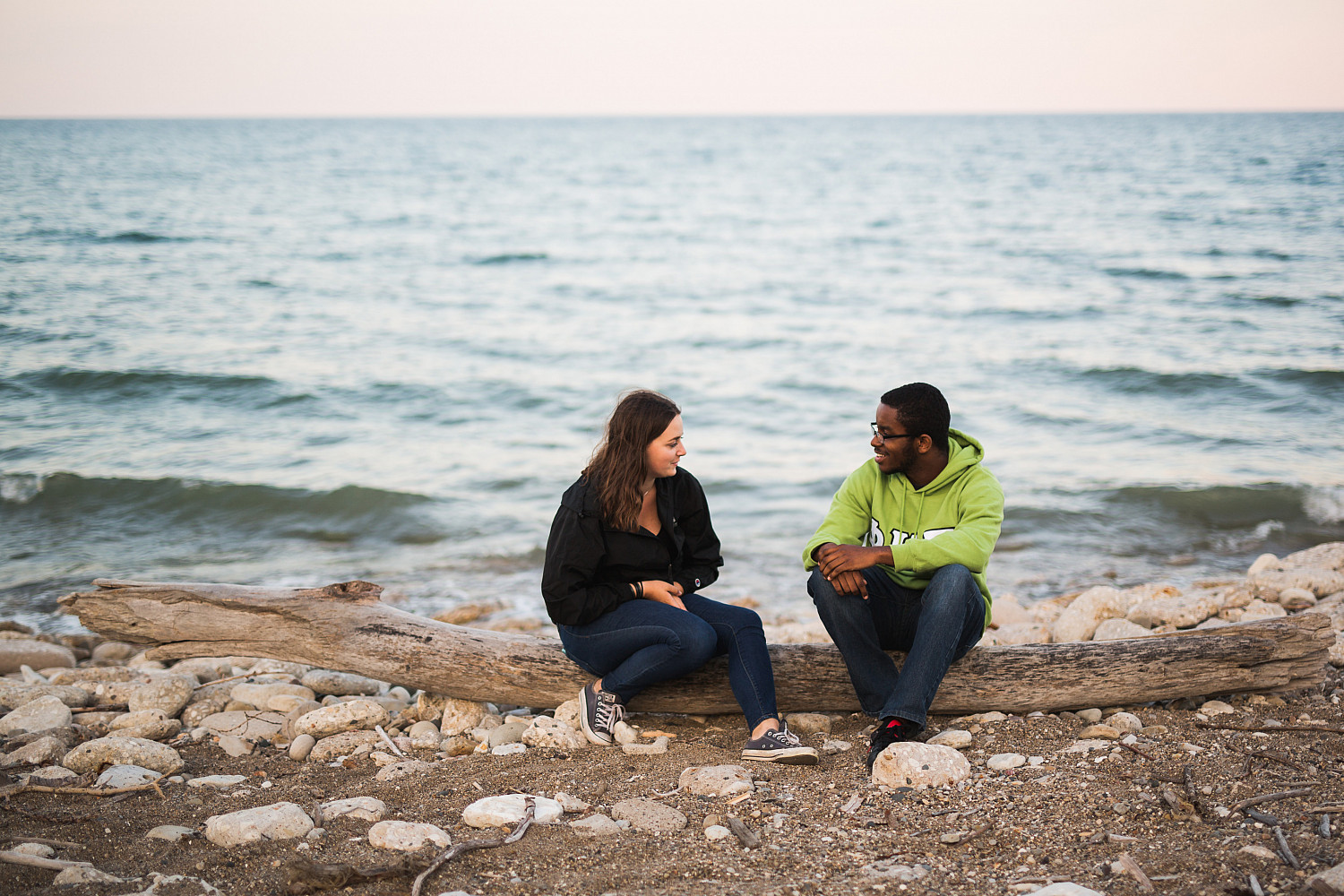 Two students hang out by the lake.