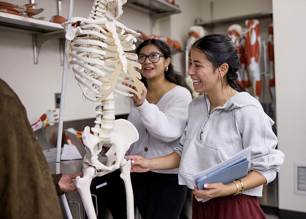 Pre-med students with skeleton