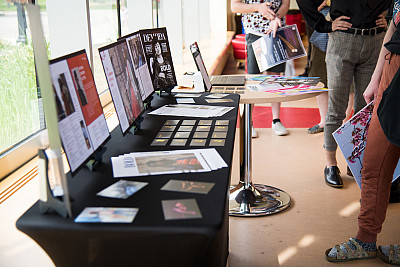 A photo from the 2022 Art Walk, where Carthage students, including graphic design majors, display...