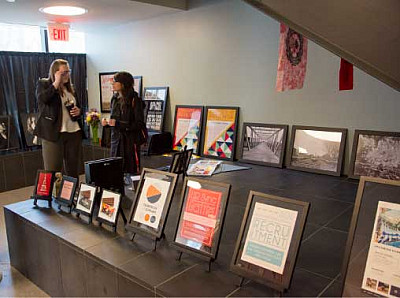 Graphic Design majors showcasing their work in the 2018 Senior Show.