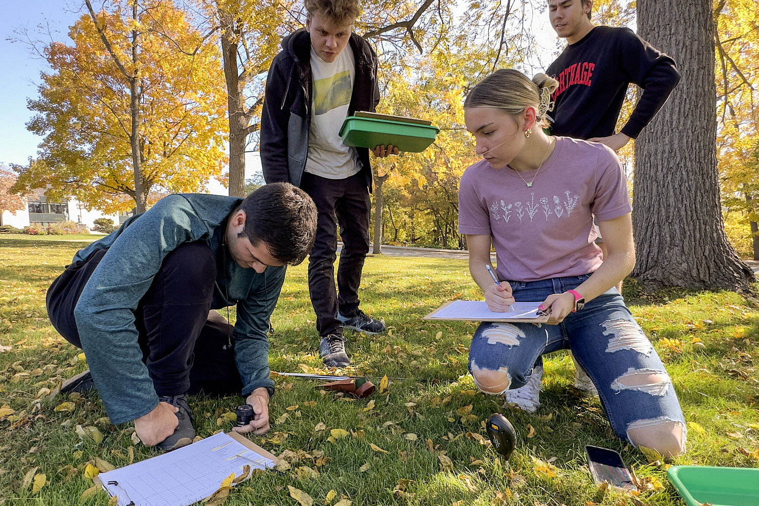 Students participating in an outdoor biology project.