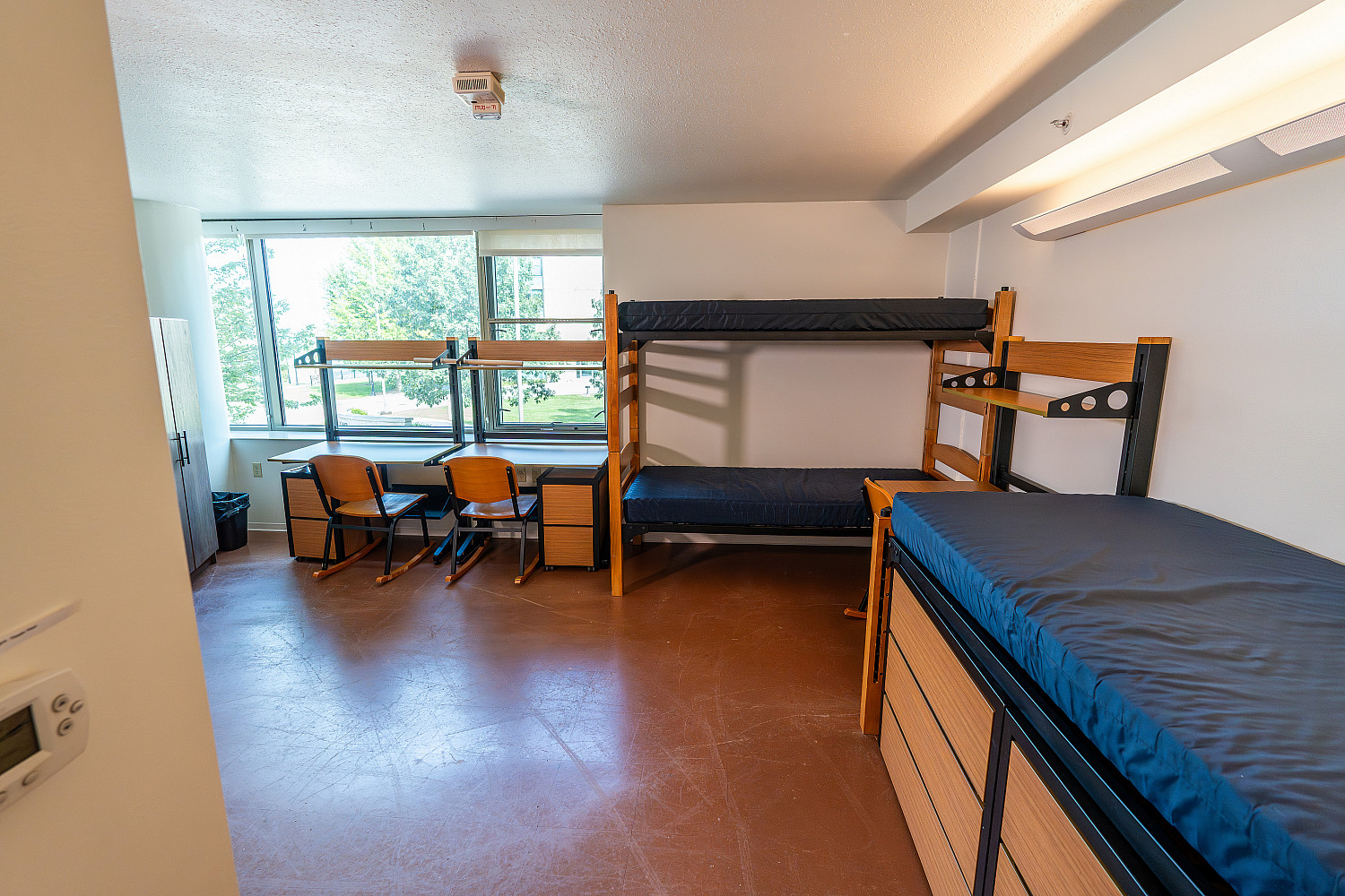 An empty triple dorm in The Oaks.