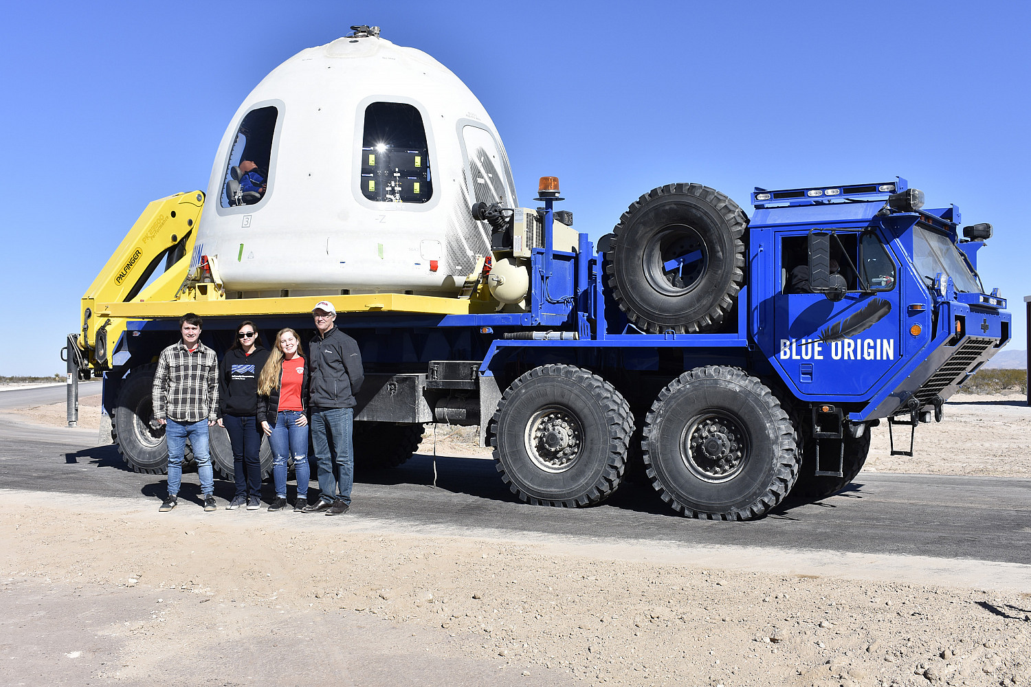 Carthage's MPG-TRIO experiment team in front of the New Shepard capsule after the NS-10 mission landing and recovery.