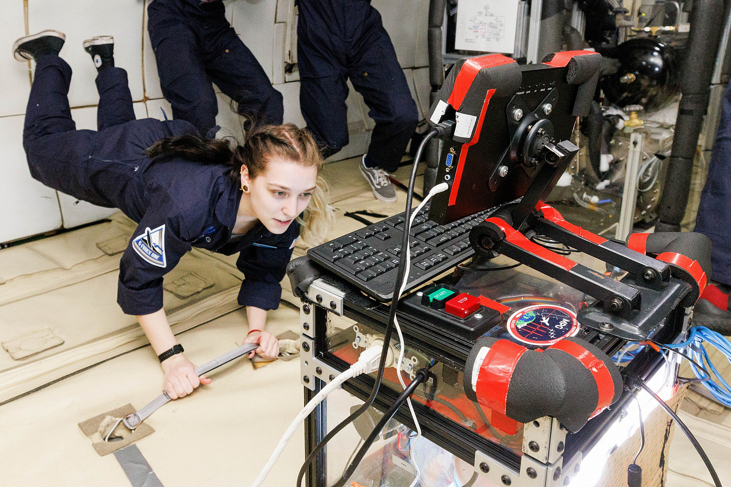 Carthage space science students testing their PROTO payload experiment on a zero-g flight.
