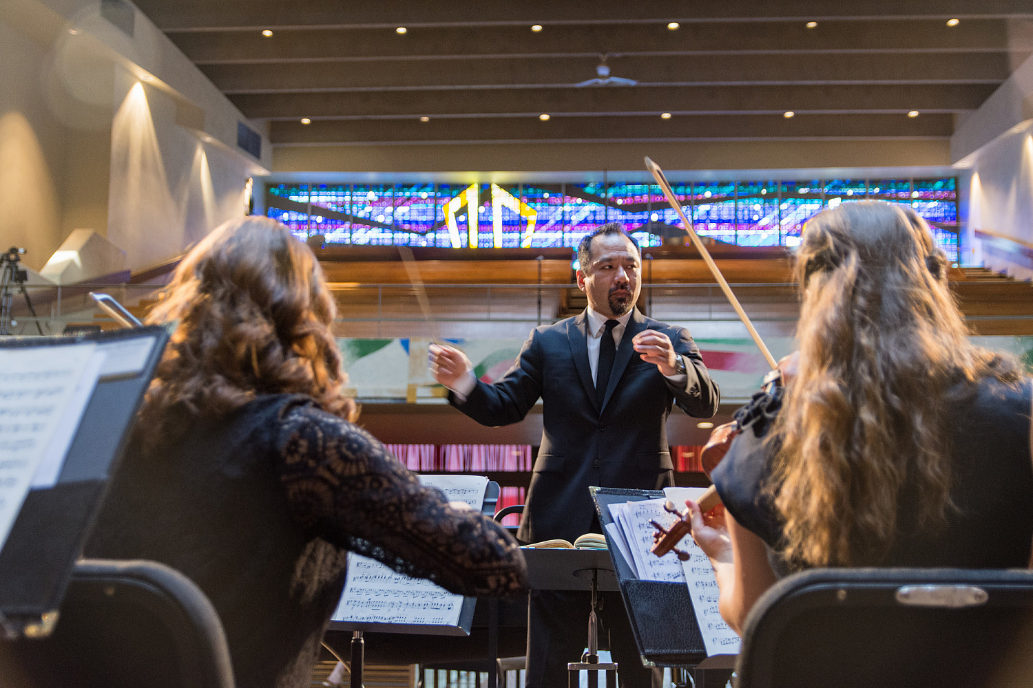 Professor Edward Kawakami and the Carthage Philharmonic.