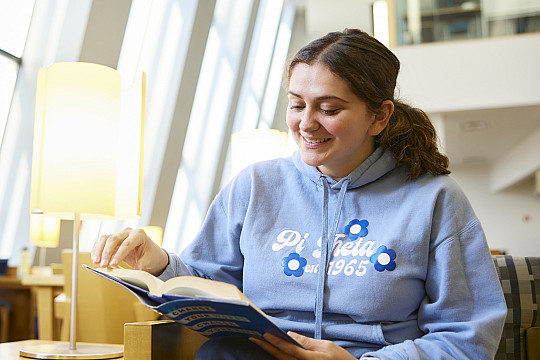 Student writing in notebook