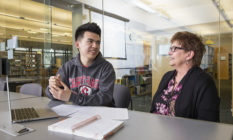 An international student meets with faculty member Jean Preston.
