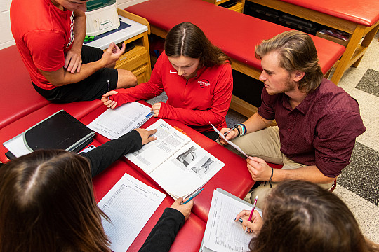 Athletic training students practice their examination skills.