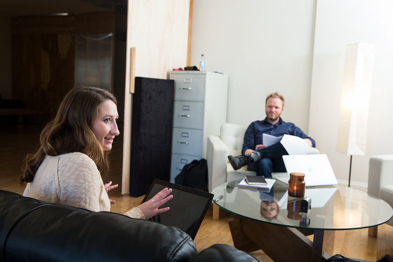 A Carthage College student works with her boss and colleagues during an off-campus internship with a video and marketing agency.