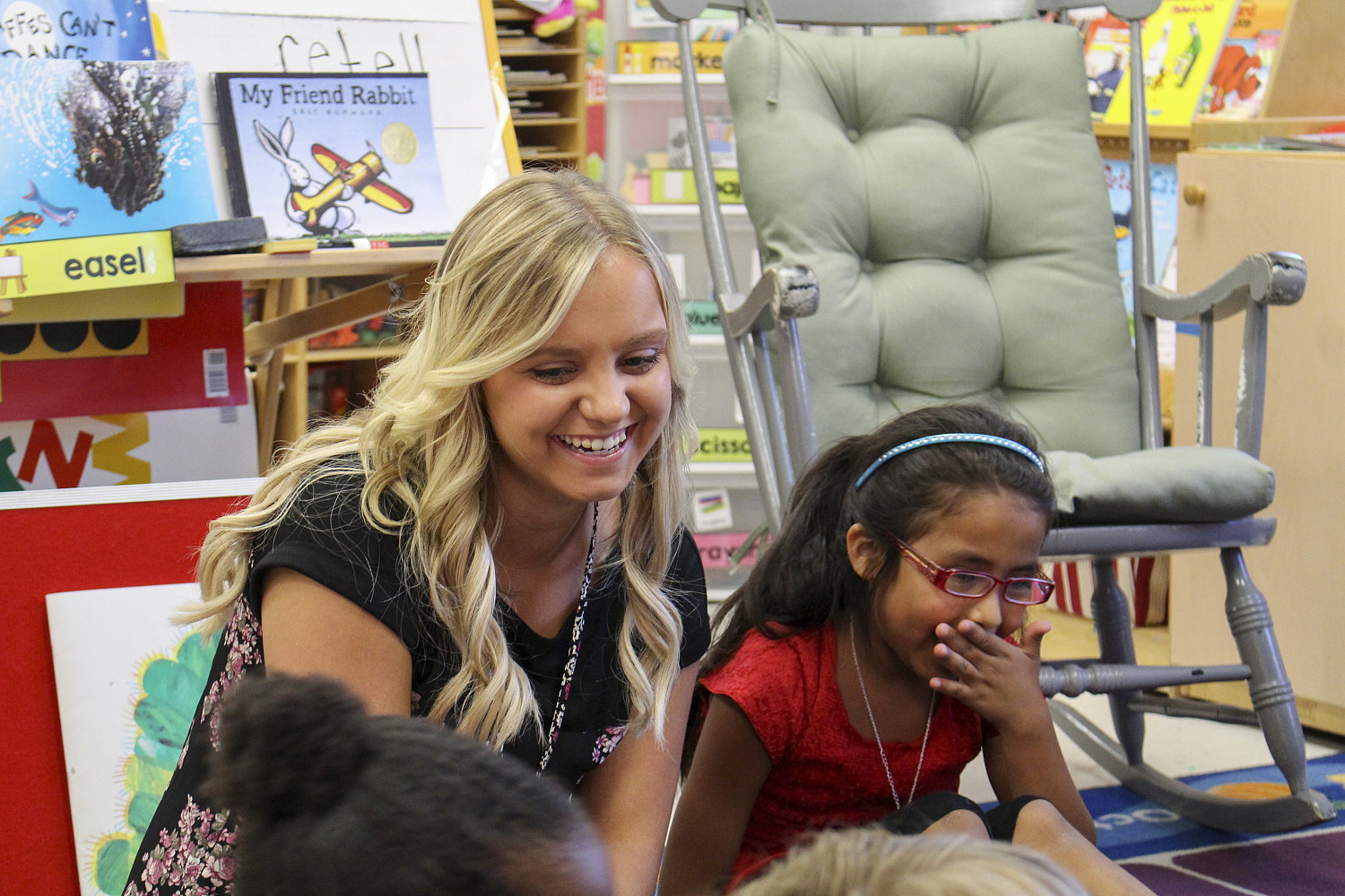 A Carthage College education student works with students in a Kenosha area classroom.