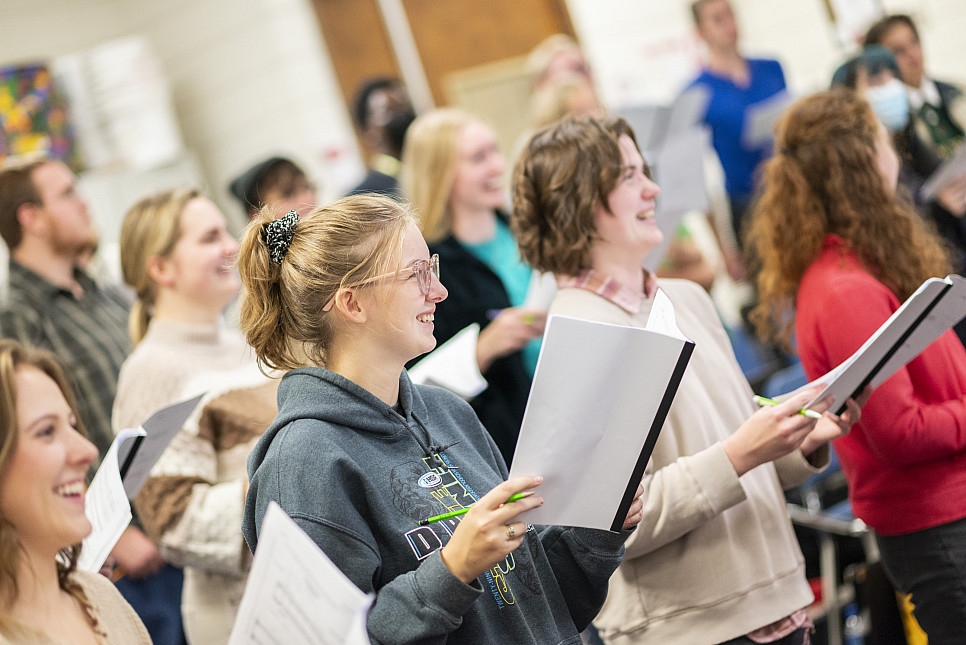 Students in the Carthage Choir rehearse with Choir Director Maggie Burk.
