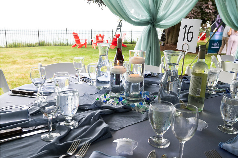 Guests can enjoy outdoor table settings overlooking Lake Michigan.