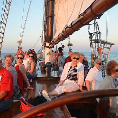 Alumni sailing on a ship.