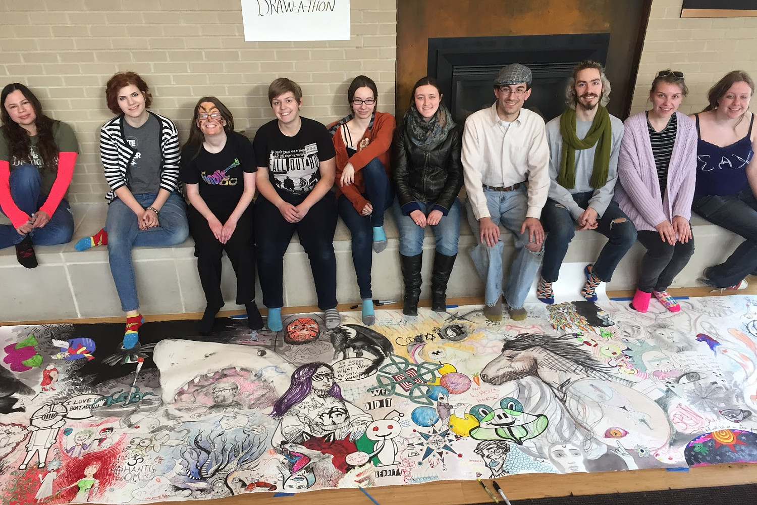 Students show off their work during a 24-hour Draw-A-Thon. (Fall 2017)