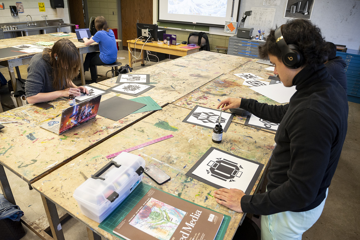 Ethan Cohen '24 finalizes designs in Foundations, Surfaces: Images + Design, (Fall 2022).