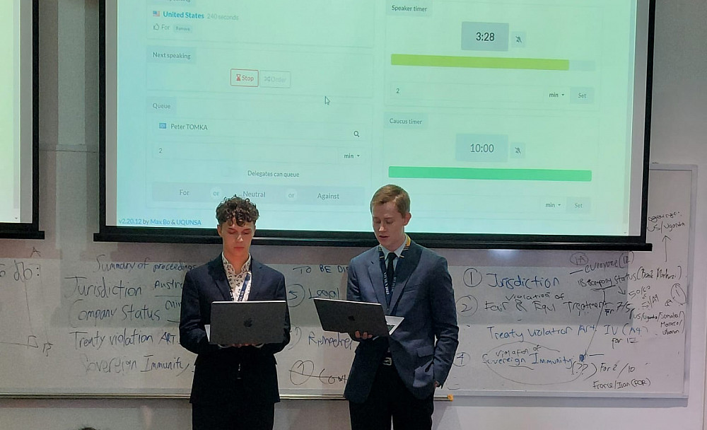 Veeti Penttinen '25 (left) representing the United States of America in the International Court of Justice (ICJ) and Michael Malyszek '25...