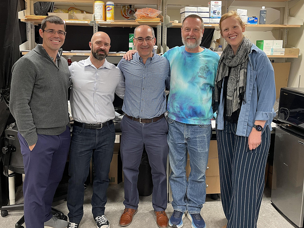 Five professors standing the in Neuroscience Lab.