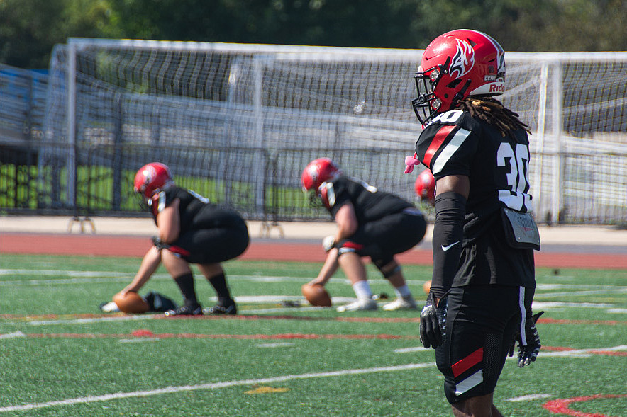 The football team defeats Elmhurst University.