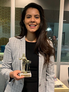 Maham Ali '19 with her award from the Mock Trial tournament at Loras College in Jan. 2019. 