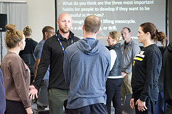 People conversing in a room.