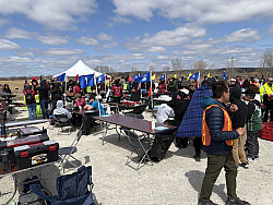 People building rockets on tables outside.