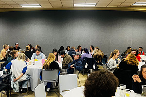 Students having a discussion over a meal.