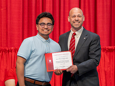 Distinguished Senior Juan Gomez-Solis is shown with Professor Neil Scharnick at the Celebration of Scholars awards ceremony.
