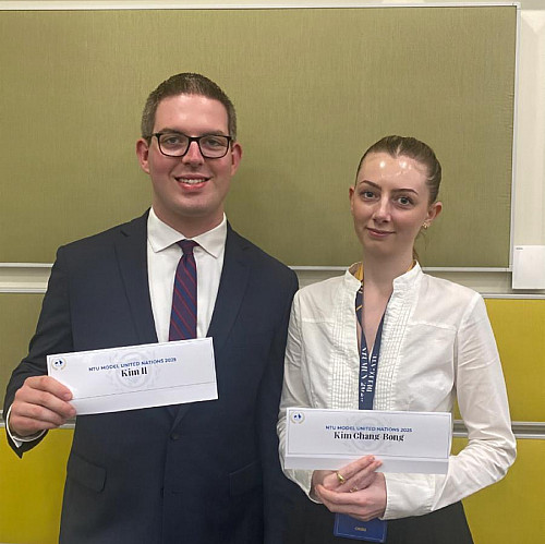 Nathan Swensen '26 (left) and Marion Pognat '26 (right) representing in the Joint Cabinet Crisis.
