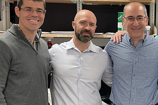Five professors standing the in Neuroscience Lab.
