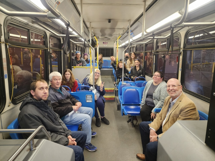 Participants in the Kenosha Transportation Academy ride a Kenosha Transit bus as part of their tour of local transportation systems.