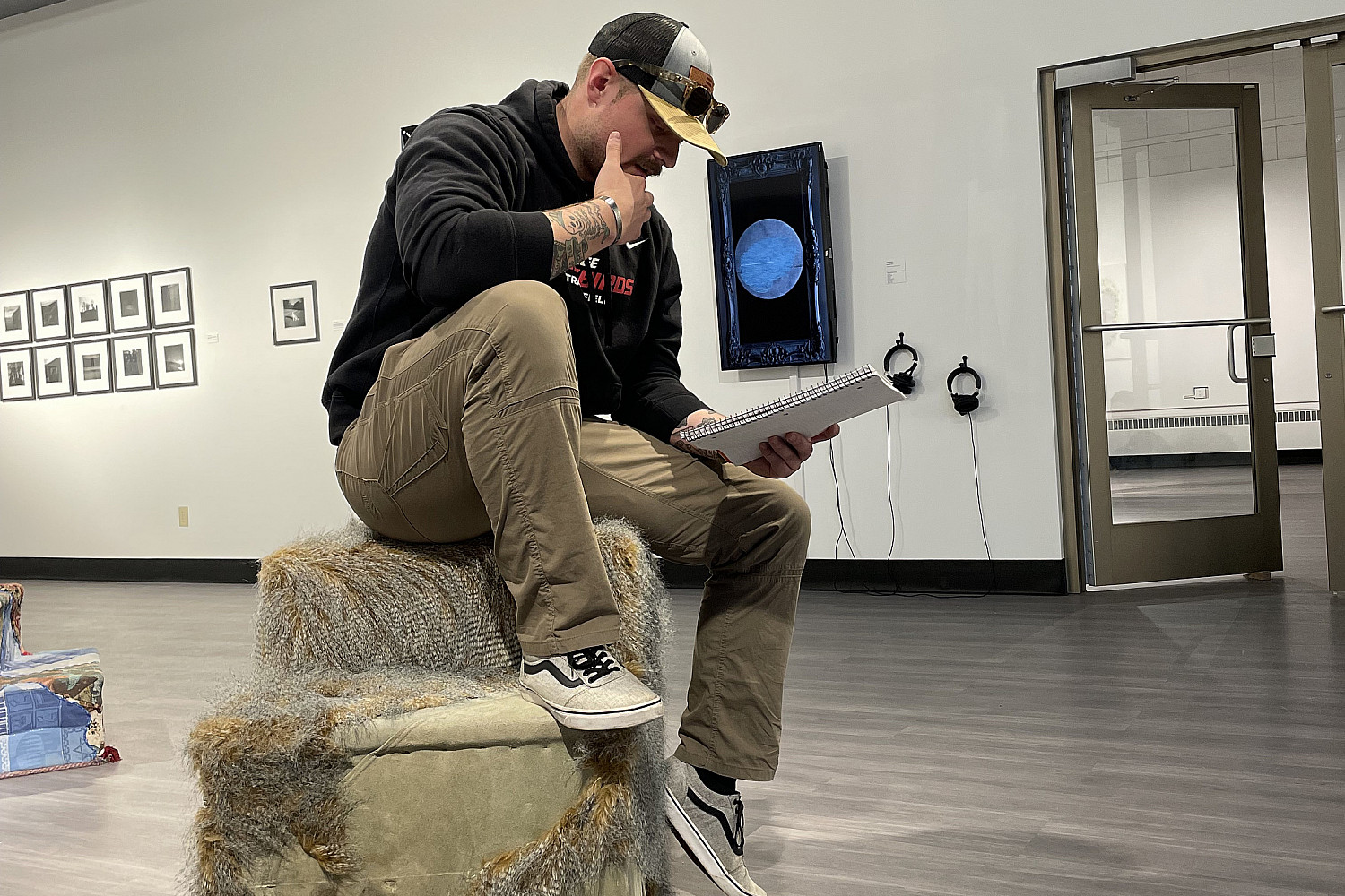 A student reading in the H. F. Johnson Gallery of Art.