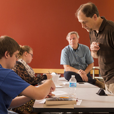 Prof. Quashnock helps a student in class.