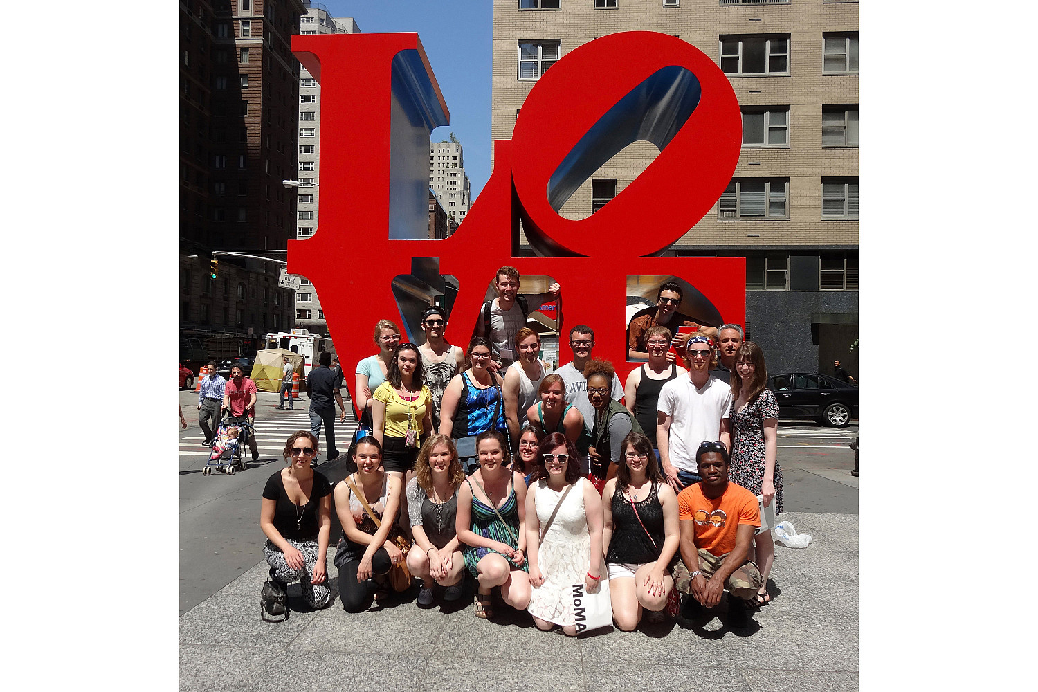 A group photo of the 'Love' monument in New York City.