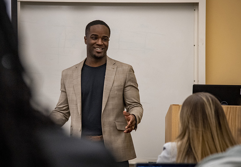 A student in the graduate studies business program presents to the class.