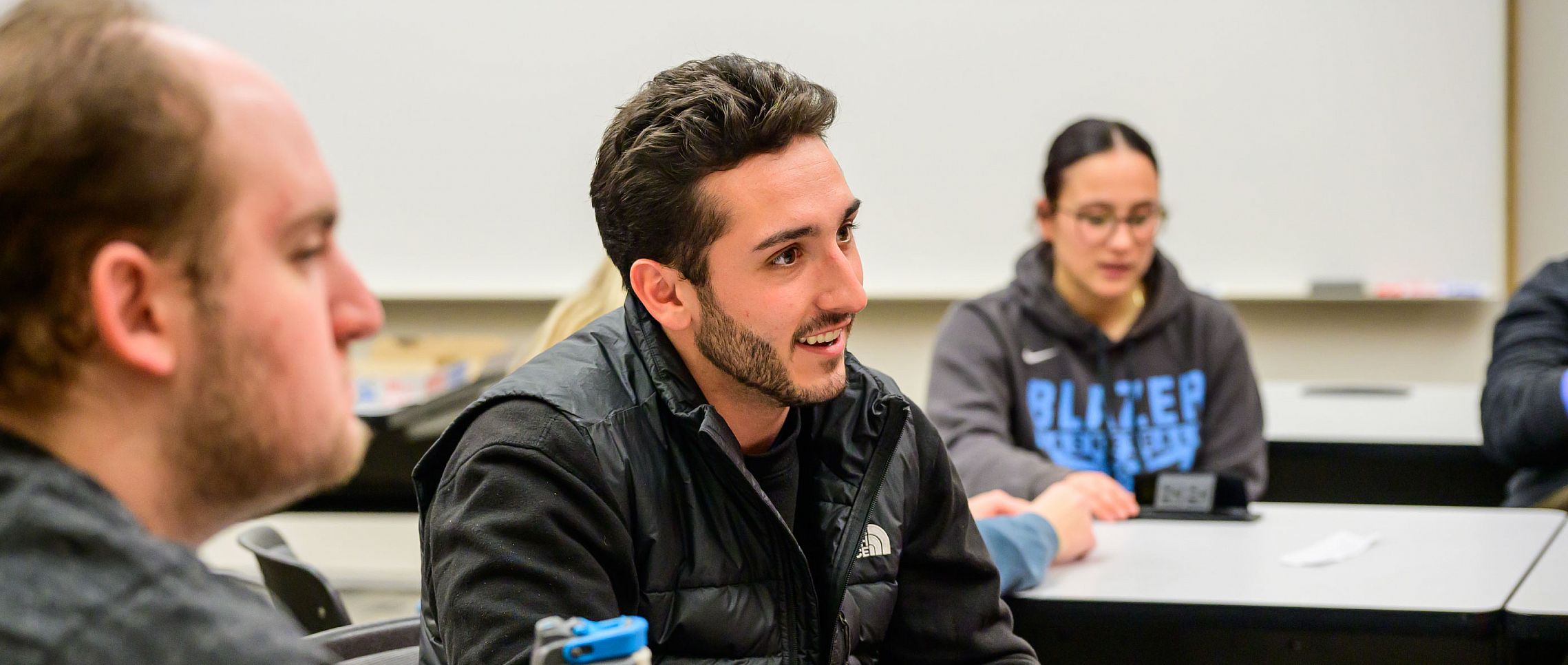 Students in Carthage College's Master of Science in Business - Design & Innovation engaging in a class discussion.