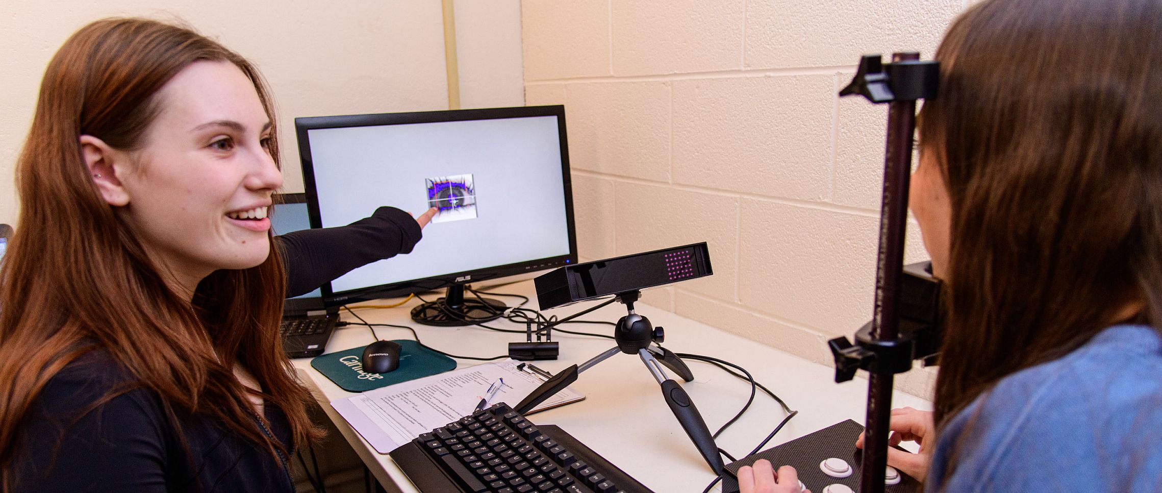 Carthage College students conducting research in the Psych Lab.