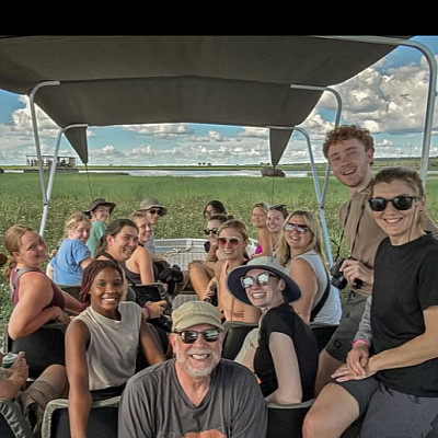 A group photo of students on a safari during J-Term.
