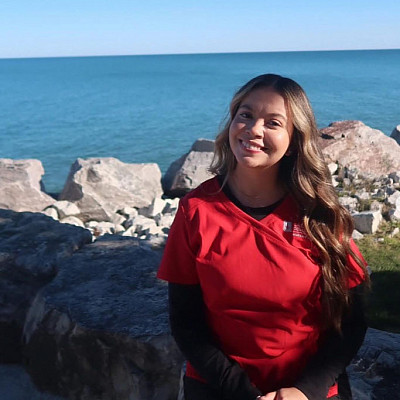 A Carthage Nursing student by the lake.