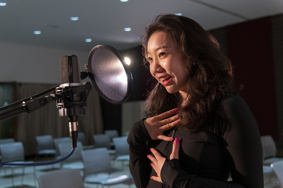 A student practices her vocals in the Master of Music program.