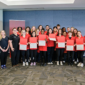 CNA cohort group photo with their certificates.
