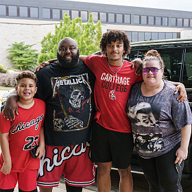 A new Carthage football player and family pose during move-in.