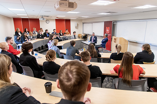 Kunal Kapoor, CEO of Chicago-based Morningstar, and Jim Padilla, dean of the School of Business and Economics, speaking to a classroom of...