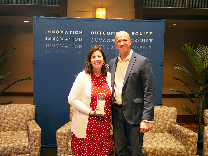 Carolyn Serdar, executive director for career and professional development, accepts the 2024 Career Services Pursuit of Excellence Award ...