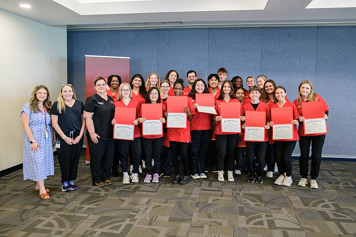 CNA cohort group photo with their certificates.
