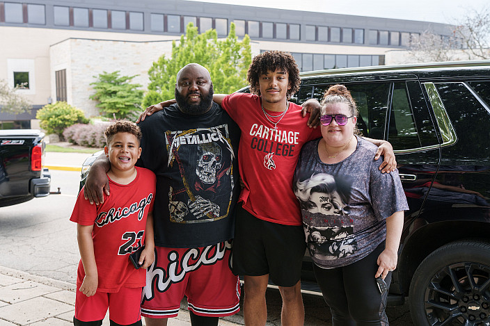 A new Carthage football player and family pose during move-in.